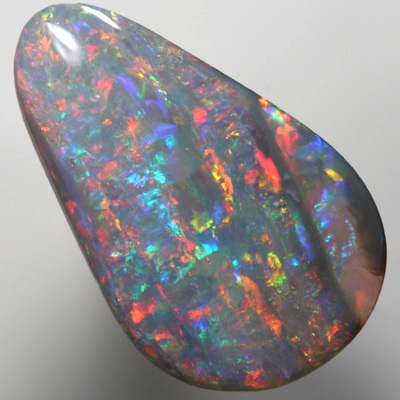 SOLID SEMI BLACK OPAL Sparkling bright red over green, Banded pattern. SEE VIDEO